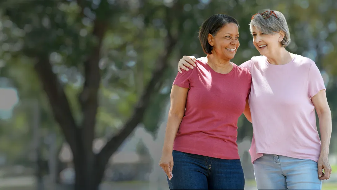 two women talking in park