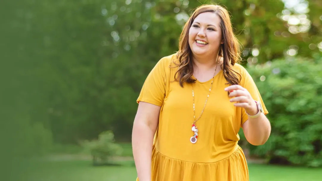 woman outside in yellow dress