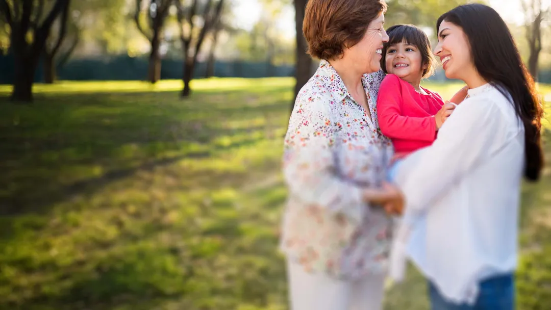 Grandmother outside with daughter and granddaughter
