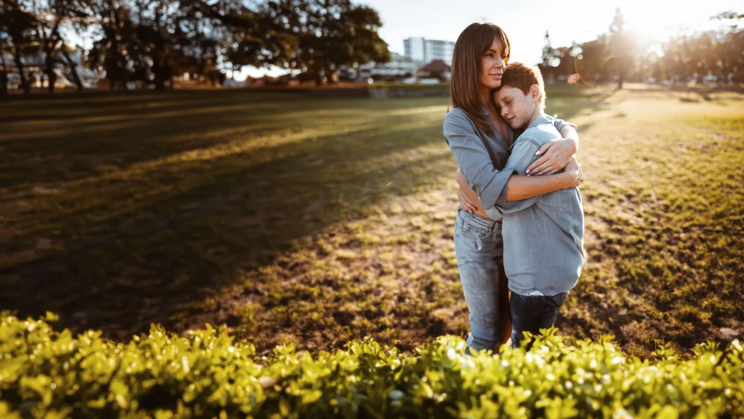 mother hugging her son