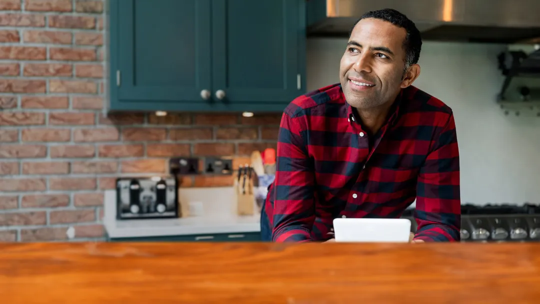 man smiling in the kitchen