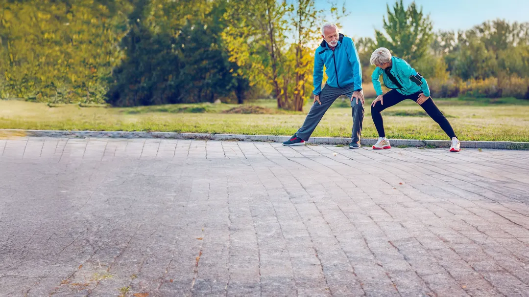 older couple exercising outdoors