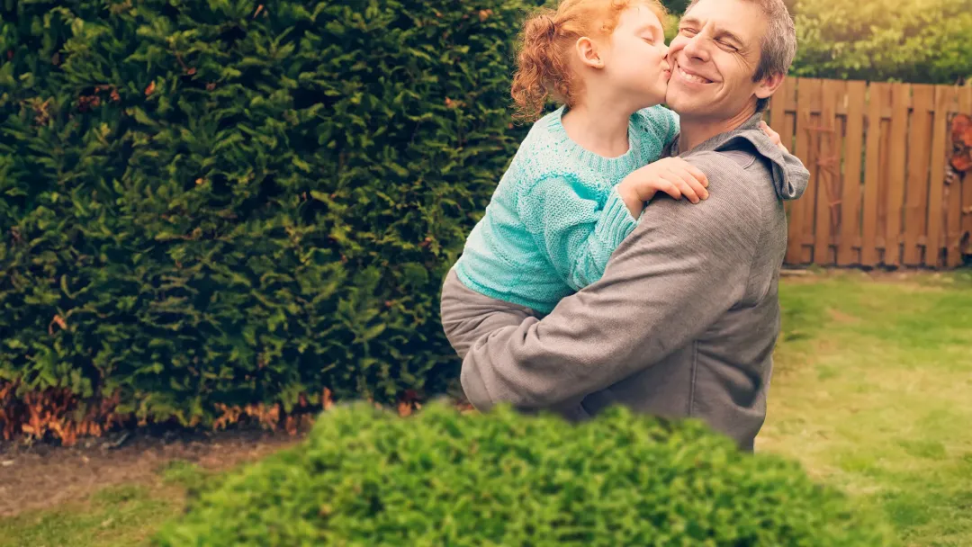 a father embracing his daughter