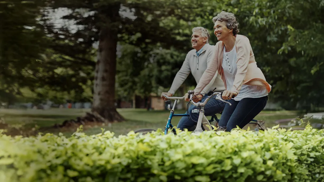 a couple riding bikes