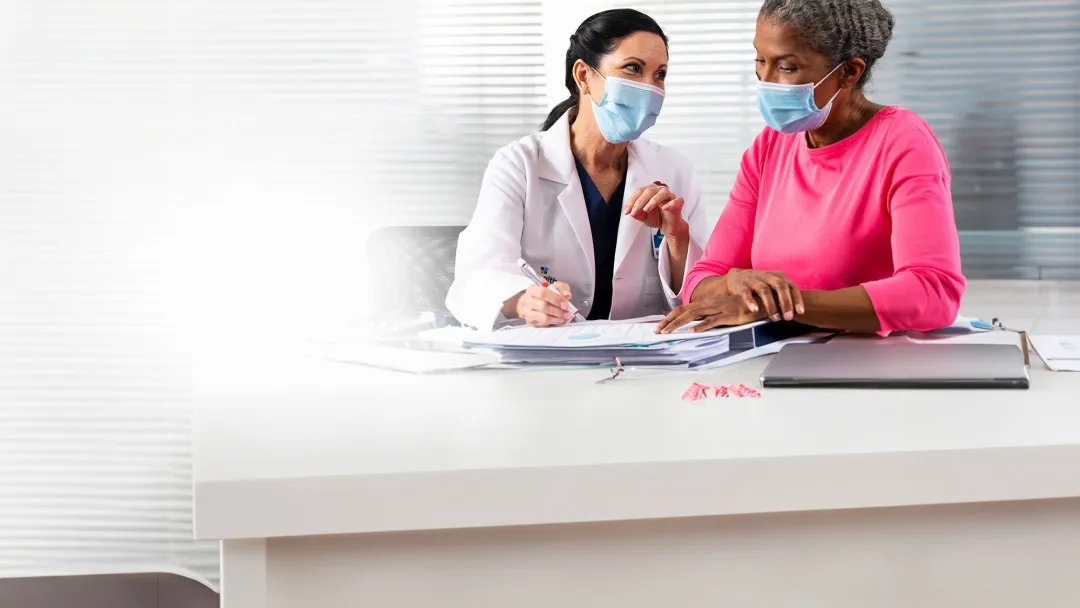 a-physician-and-a-patient-wearing-facemasks