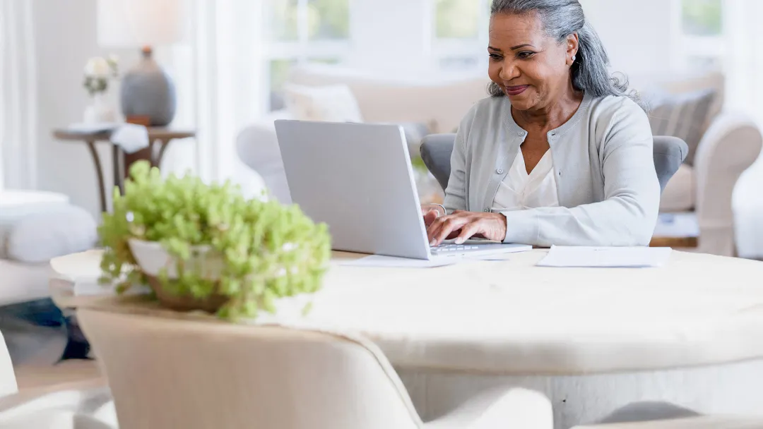 A woman using her computer at home