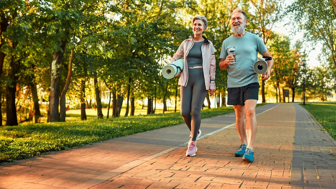 middle aged couple walking and talking