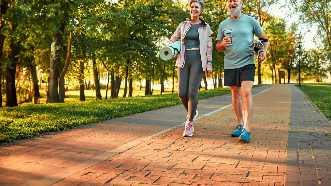 middle aged couple walking and talking
