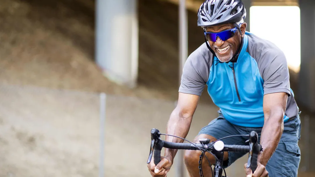 senior african american man riding a bike