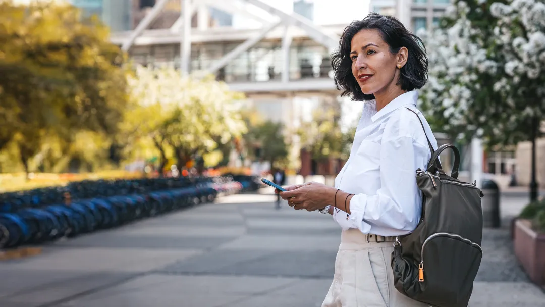 a woman walking in a metropolitan city