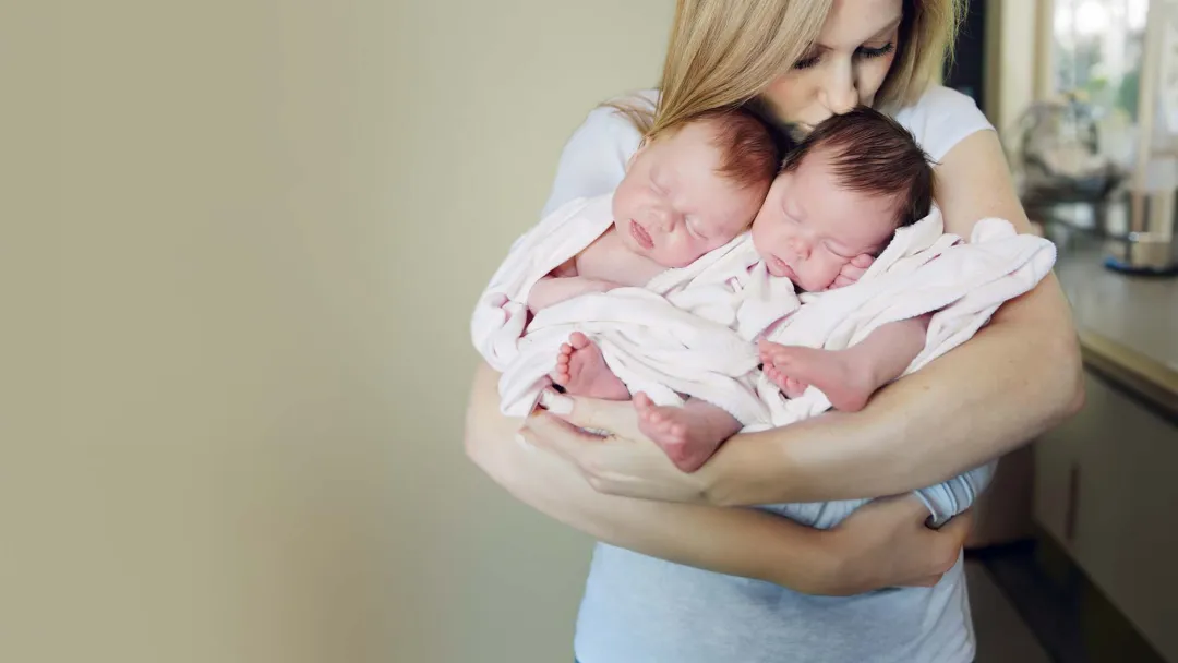 Woman holding twins
