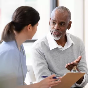 A Patient Speaks with a Provider in an Exam Room of a Medical Practice.