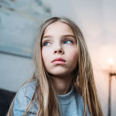 preteen girl looking up
