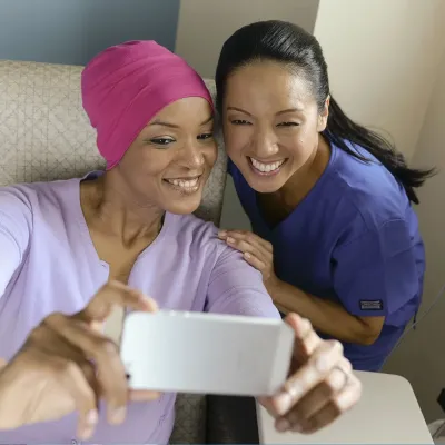 patient taking a selfy with a nurse