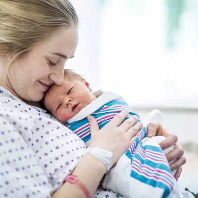 mother holds newborn baby