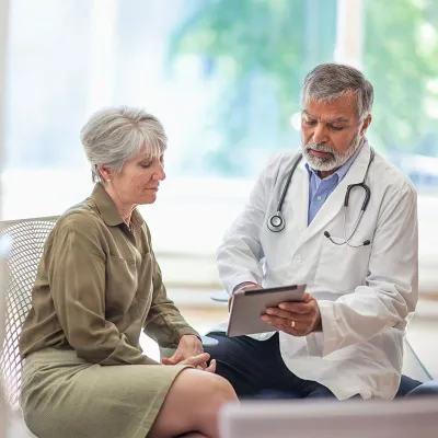 middle-aged woman talking to her provider