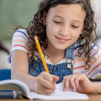 girl-is-writing-and-smiling