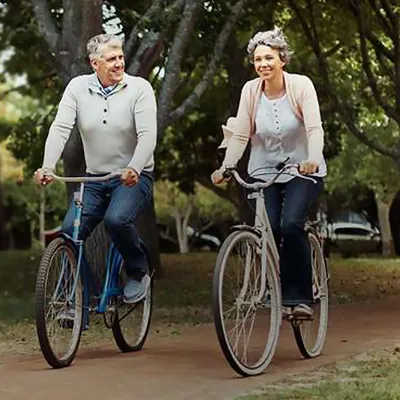an older couple riding bikes