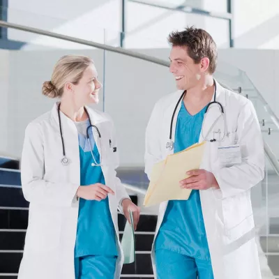 Male and female doctors chatting