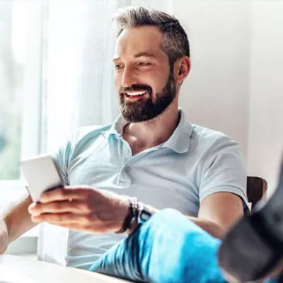 man looking at phone