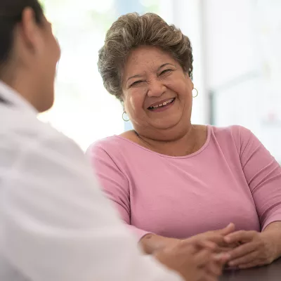 Physician and patient smiling