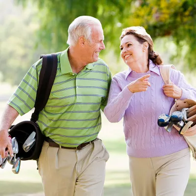 older couple playing golf
