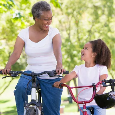 mother daughter ridding bikes
