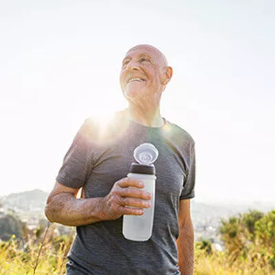 older-man-holding-a-water-bottle