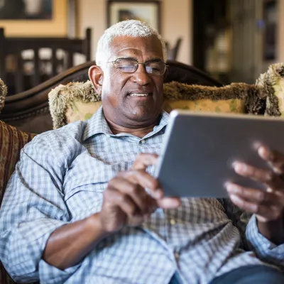 LP-Circle-Insert-Large-Neuro-General-WestFL-man-sitting-with-tablet