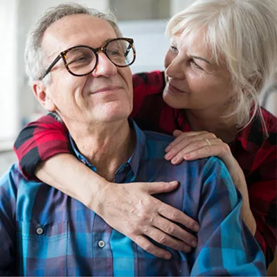 LP-Circle-Insert-Large-Neuro-General-WestFL-woman-hugs-husband