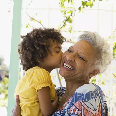 grandma-with-her-grandaughter-kissing