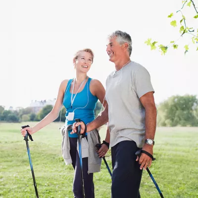 a-couple-hiking-and-smiling