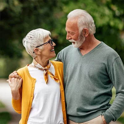 couple-walking-and-looking-at-eachother