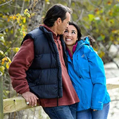 Middle-aged couple standing close in park