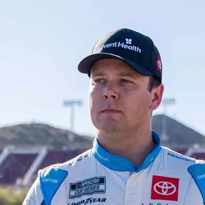 NASCAR racer Erik Jones with AdventHealth hat