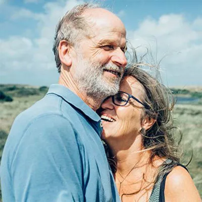 Senior couple embracing outside