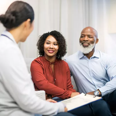 lp-circle-insert-small-digestive-general-west-couple-smiling-with-doctor.jpg.