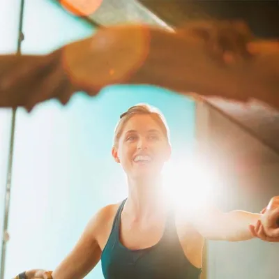 Woman joining arms and exercising