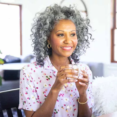 Gray-haired woman with tea