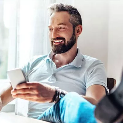 LP-Circle-Large-West-FL-Neuro-aneurysm-Man-sitting-with-phone