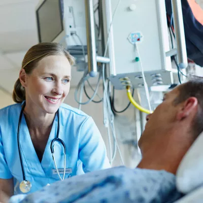 doctor-talking-to-patient and smiling