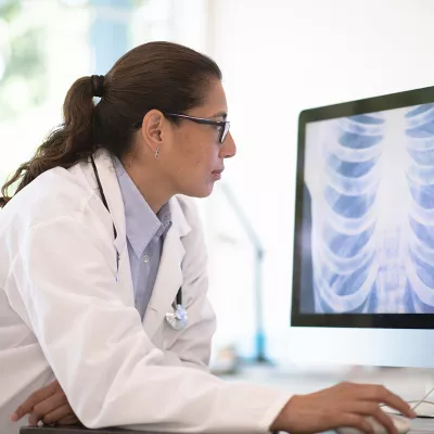 a-physician-looking-at-a computer-screen