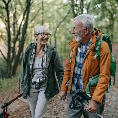couple walks through the woods with healthy lungs
