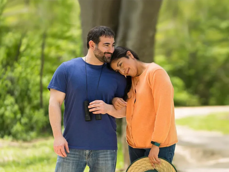 Middle-aged couple walking outdoors