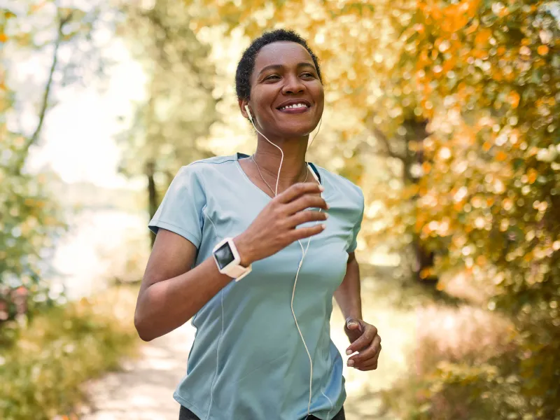 Woman running while listening to music