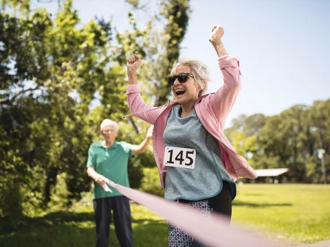 Elderly woman finishes breast cancer fundraising event