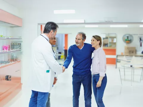 lp-50-50-digestive-colorectal-west-a-mature-couple-shaking-hands-with-doctors
