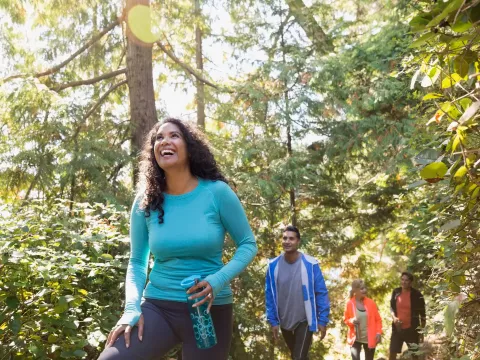 Woman Hiking in the woods with family