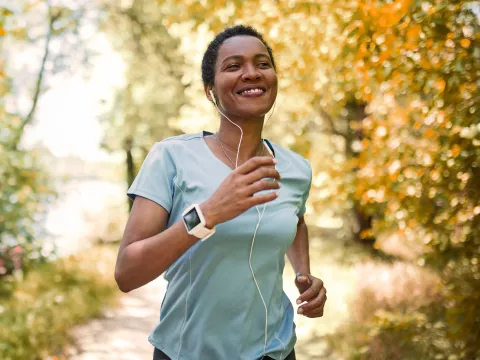 Woman running while listening to music