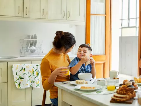 Mother and son enjoying breakfast